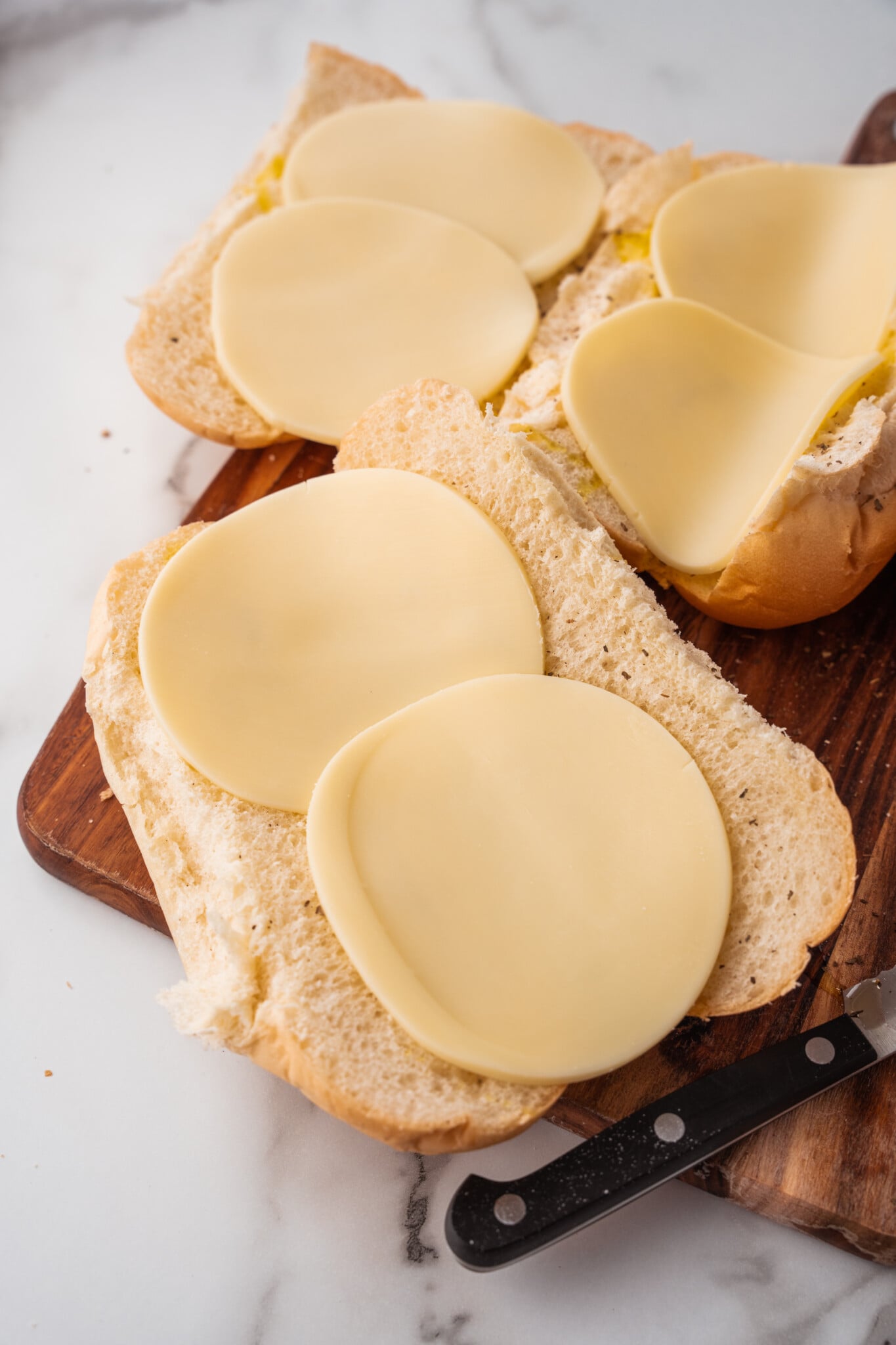 Hot griddled meats piled onto a provolone lined hoagie roll