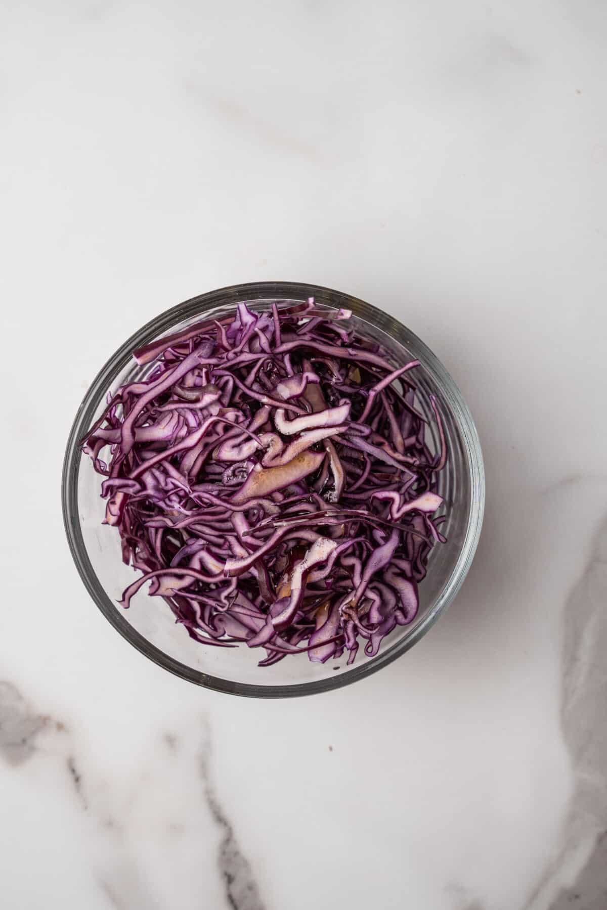 Red cabbage sliced in a bowl.