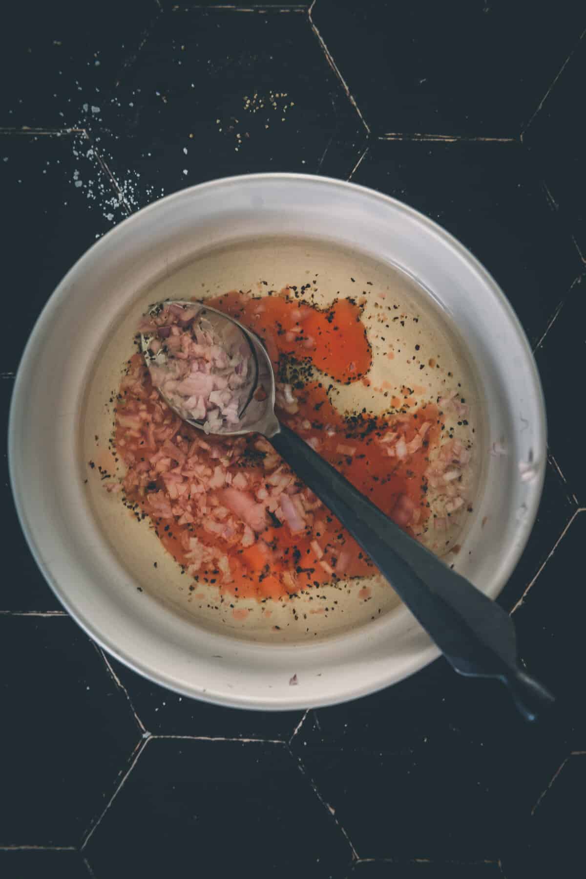 Shallot and oil, added to a bowl.  