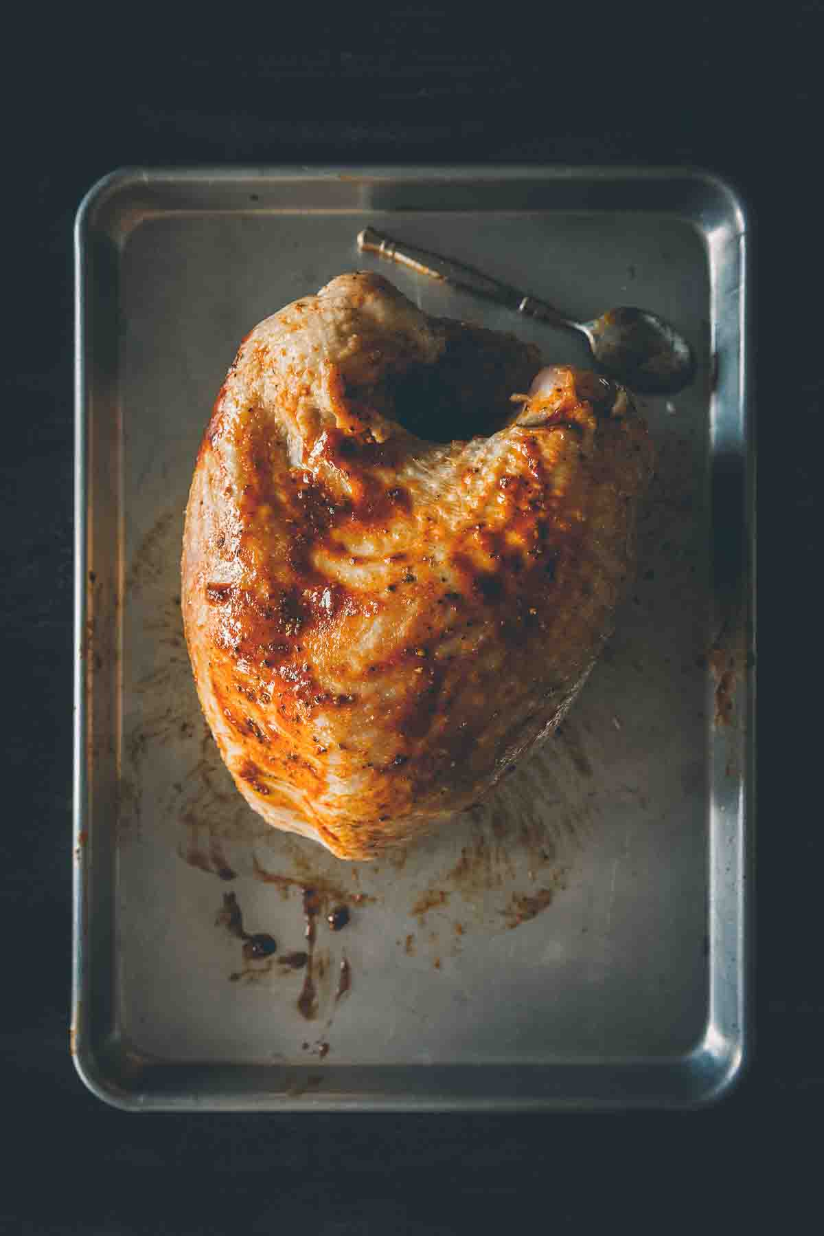 Turkey breast rubbed with glaze. 