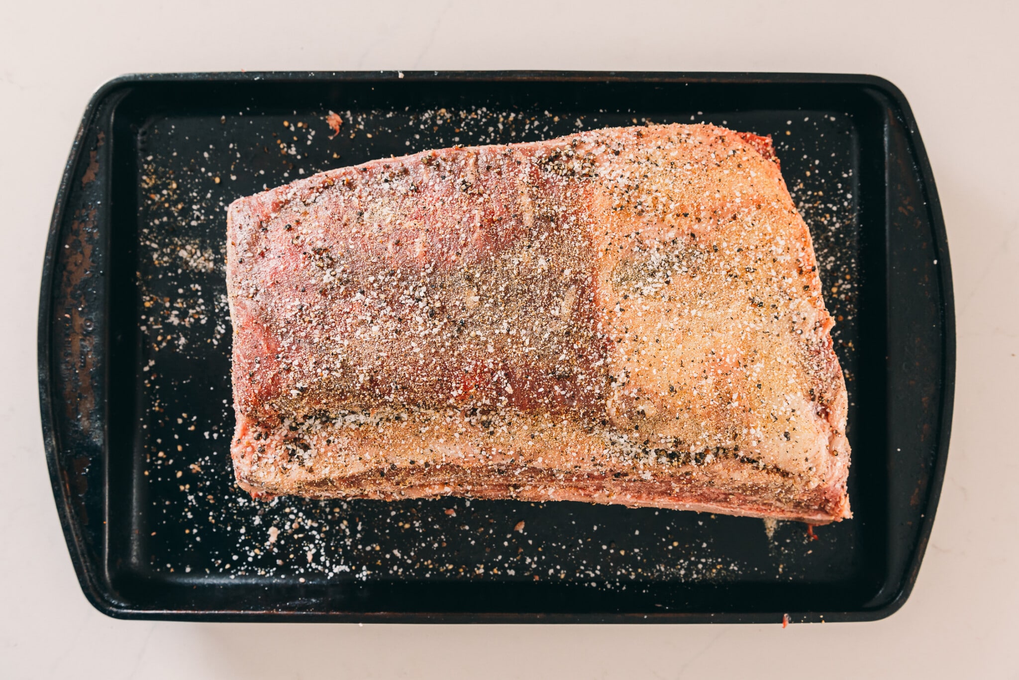 Ribs coated with salt, pepper and garlic powder blend.