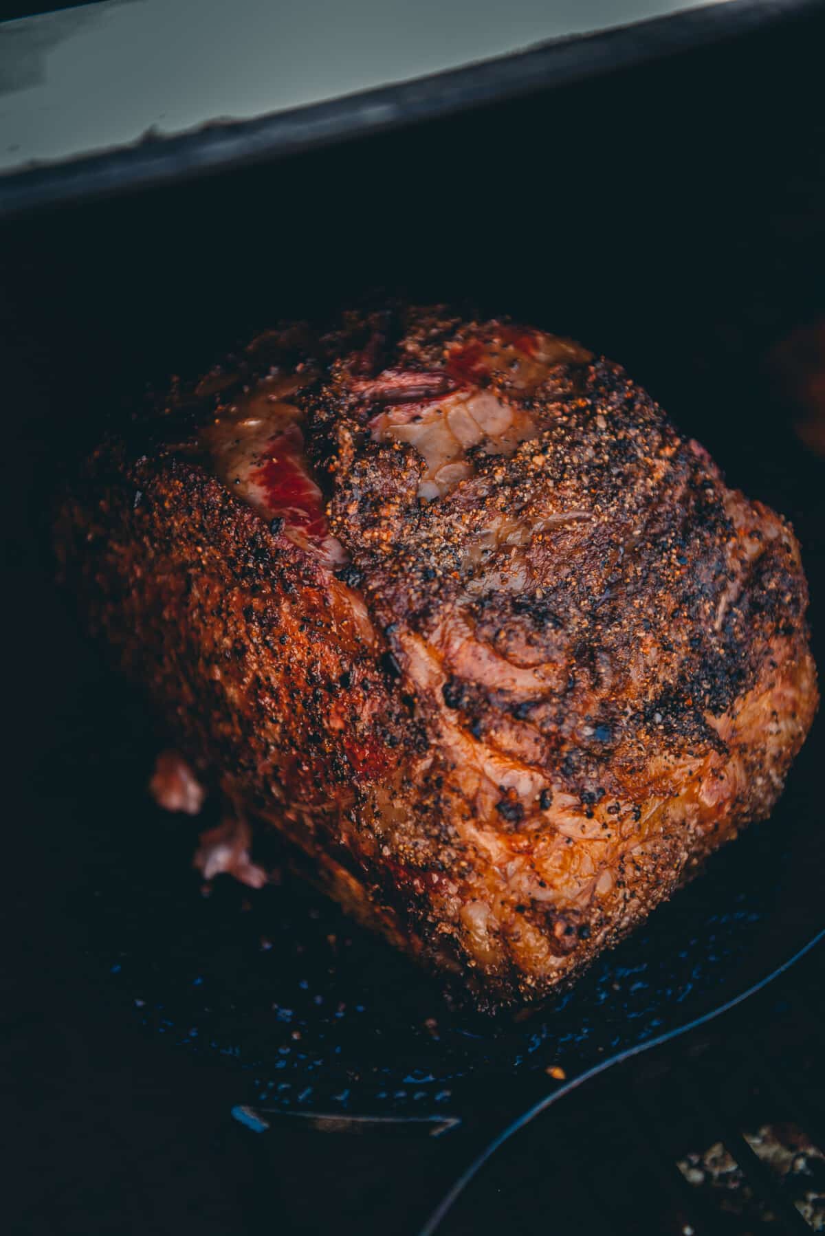 The prime rib rost after time on the smoker, picking up a beautiful red color. 