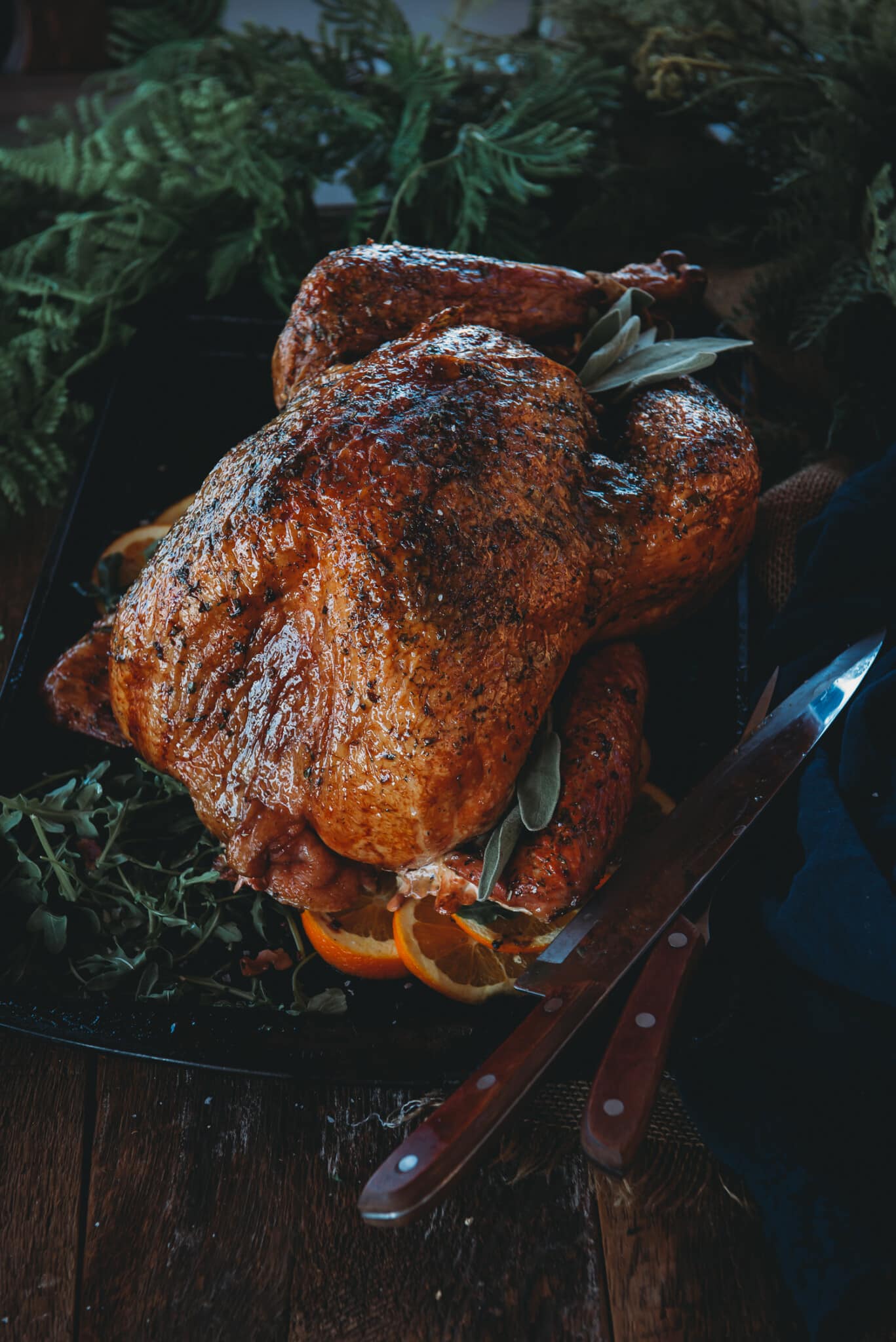 Smoked turkey on a table to be carved. 