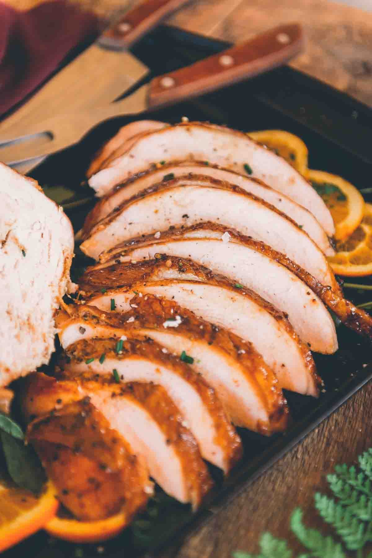 Sliced turkey breast arrange on a platter. 