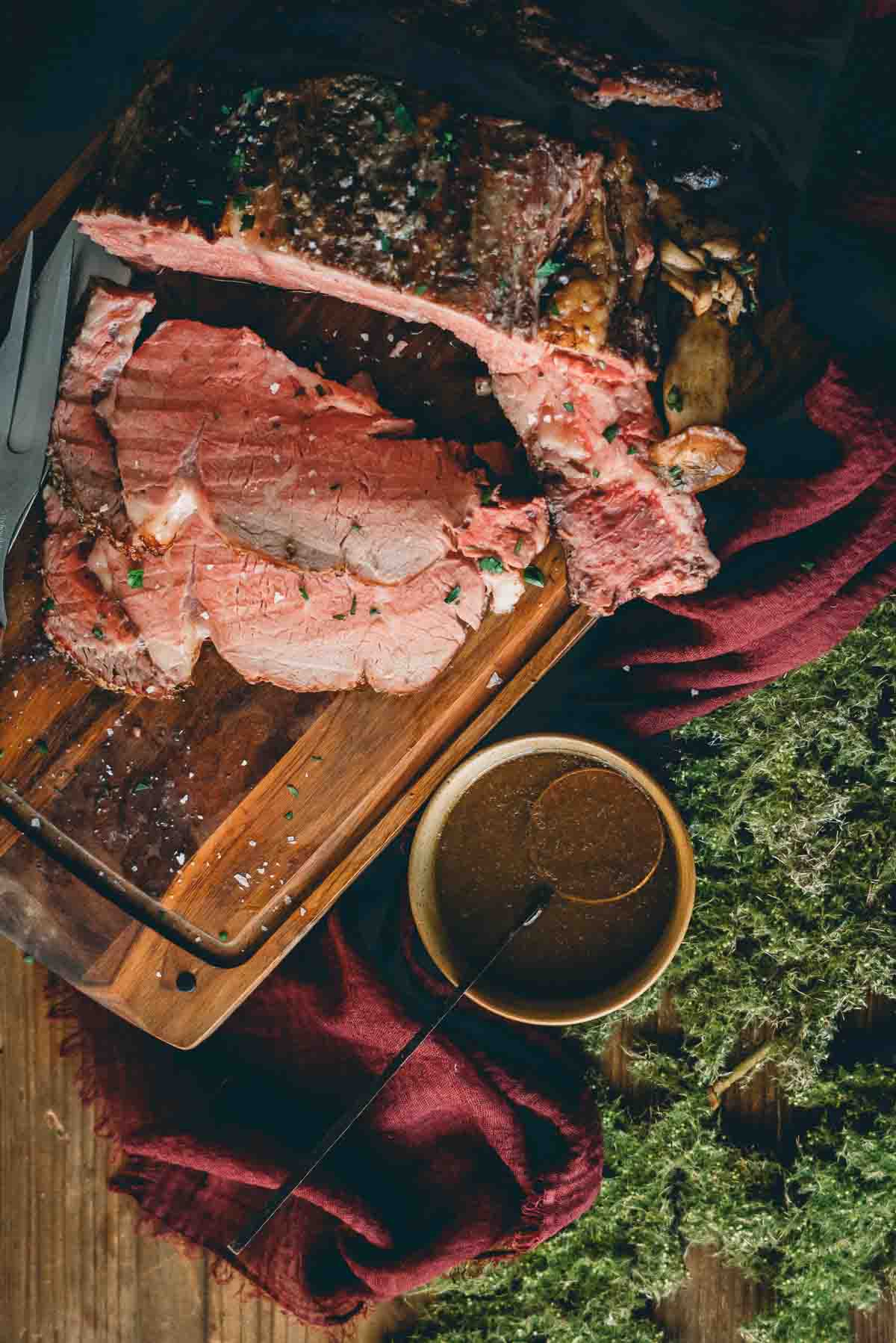 Overhead close up of sliced prime rib with au jus. 