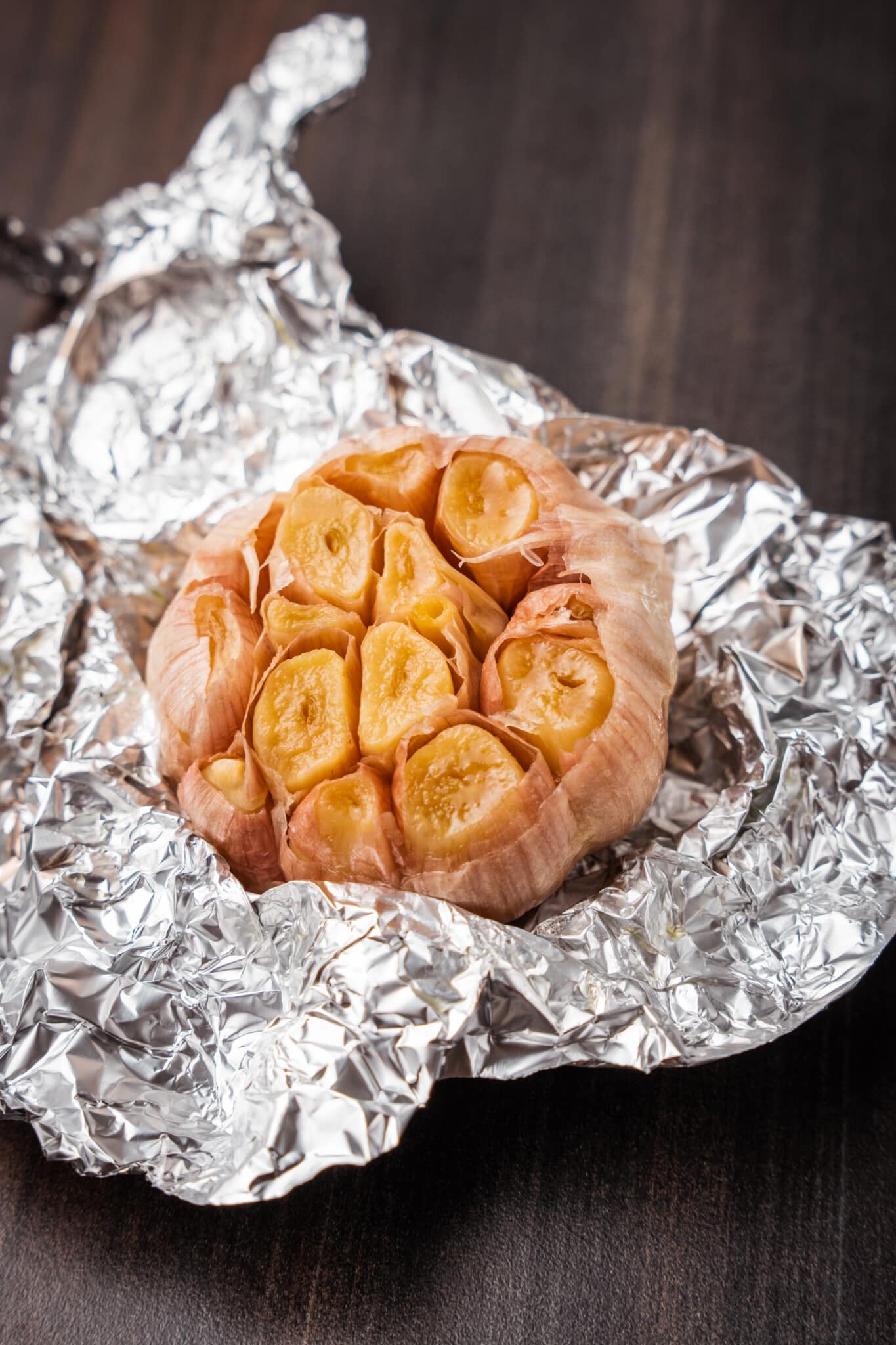 Head of roasted garlic in foil. 
