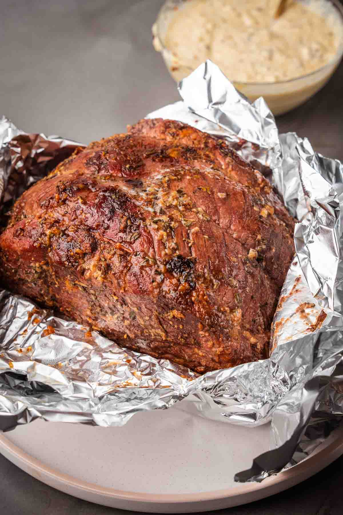 Unwrapping the roast from the foil.