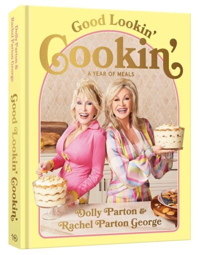 Cookbook cover titled "Good Lookin' Cookin': A Year of Meals" featuring two women, Dolly Parton and Rachel Parton George, in colorful outfits holding dessert dishes, alongside ideas for grilling gifts.