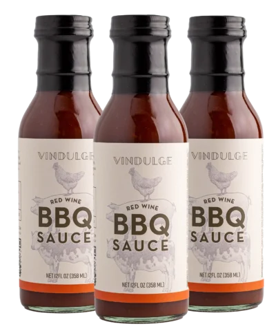 Three bottles of bbq sauce on a white background, perfect for grilling gifts.