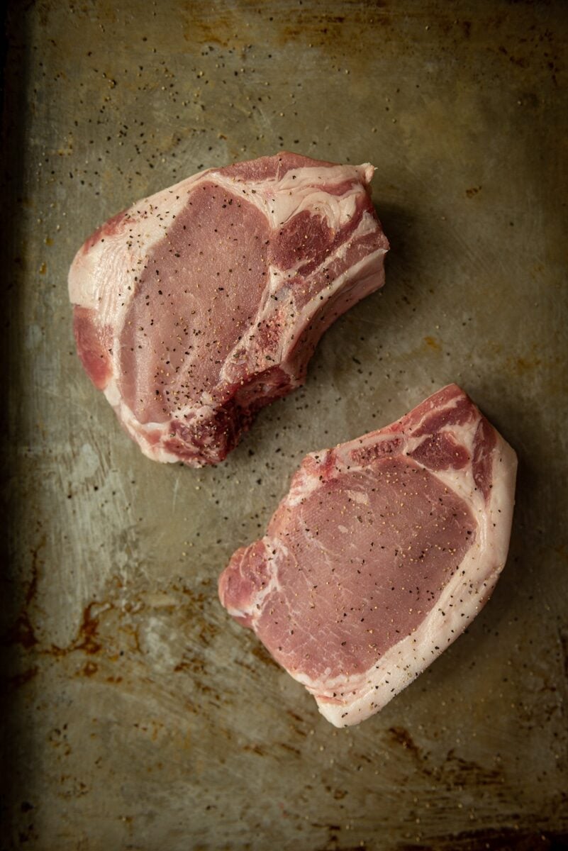 thick cut bone in pork chops ready to be grilled