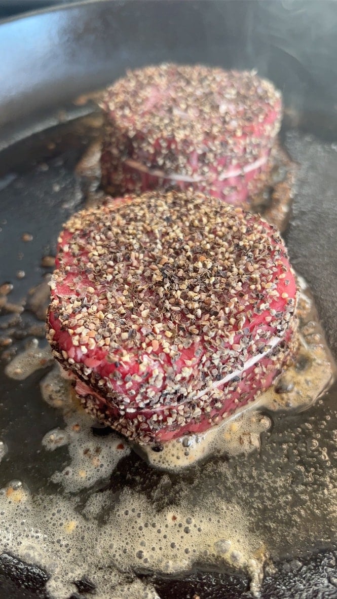 Close up of filet mignon steaks in a pan. 