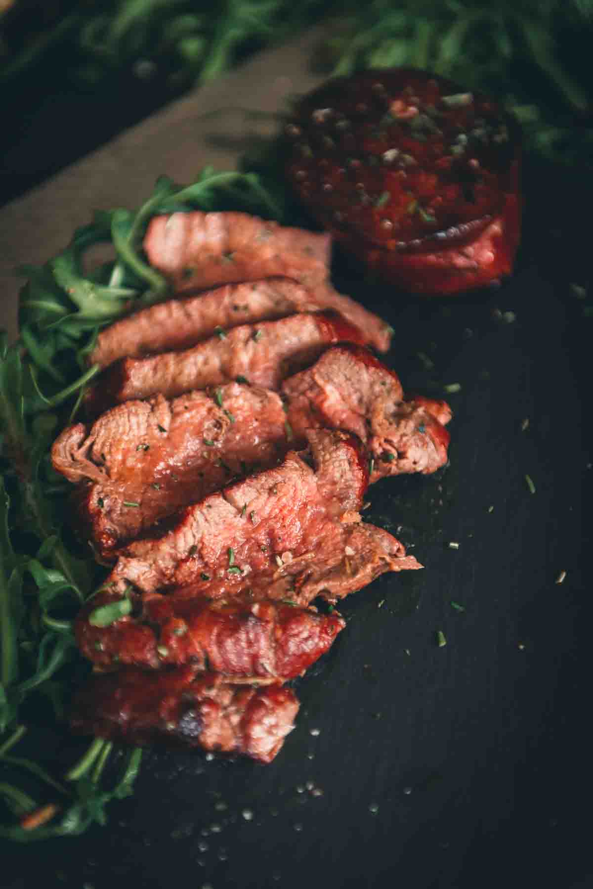 Close up of sliced grilled filet with a medium rare center. 