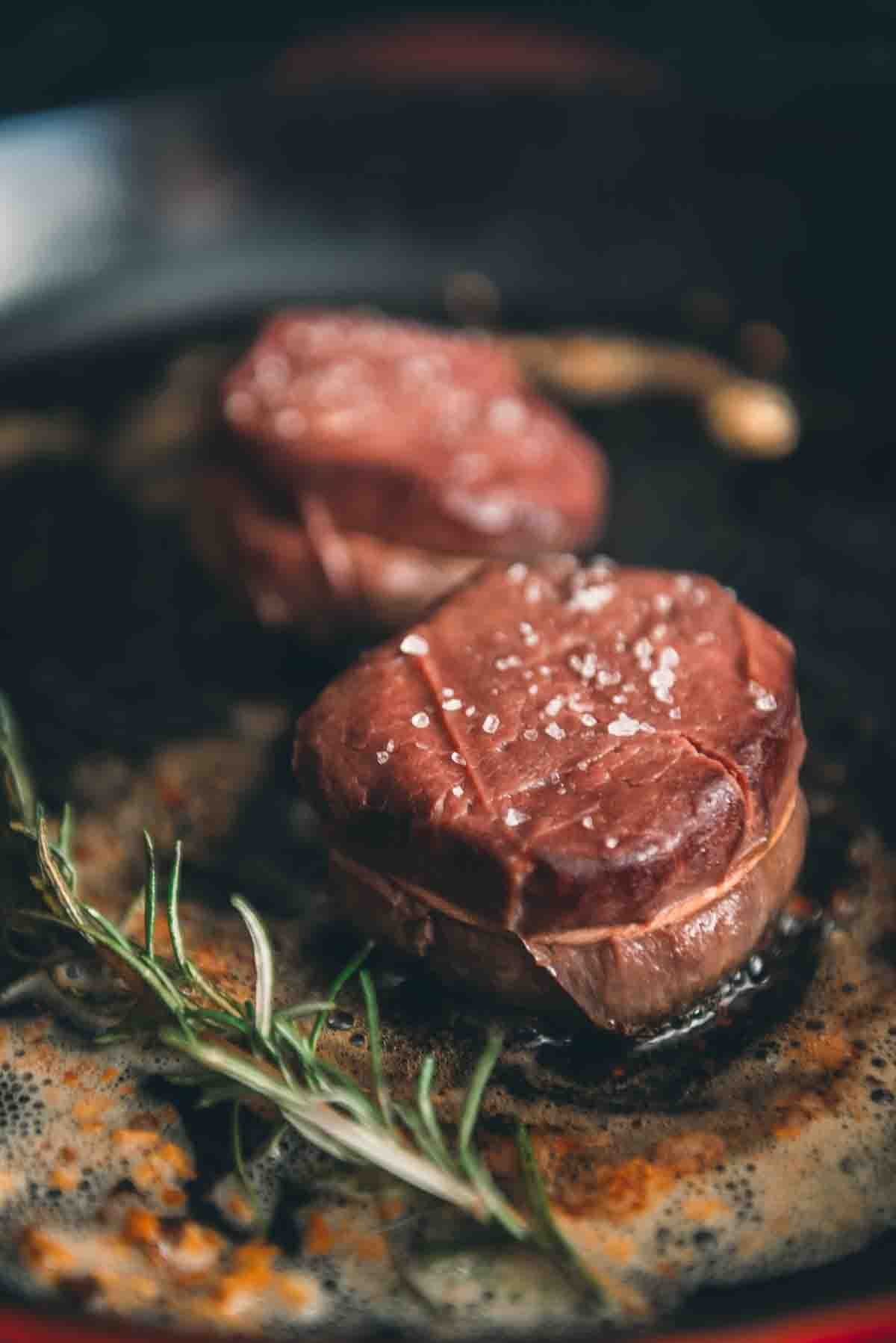 Filets placed in a hot pan.