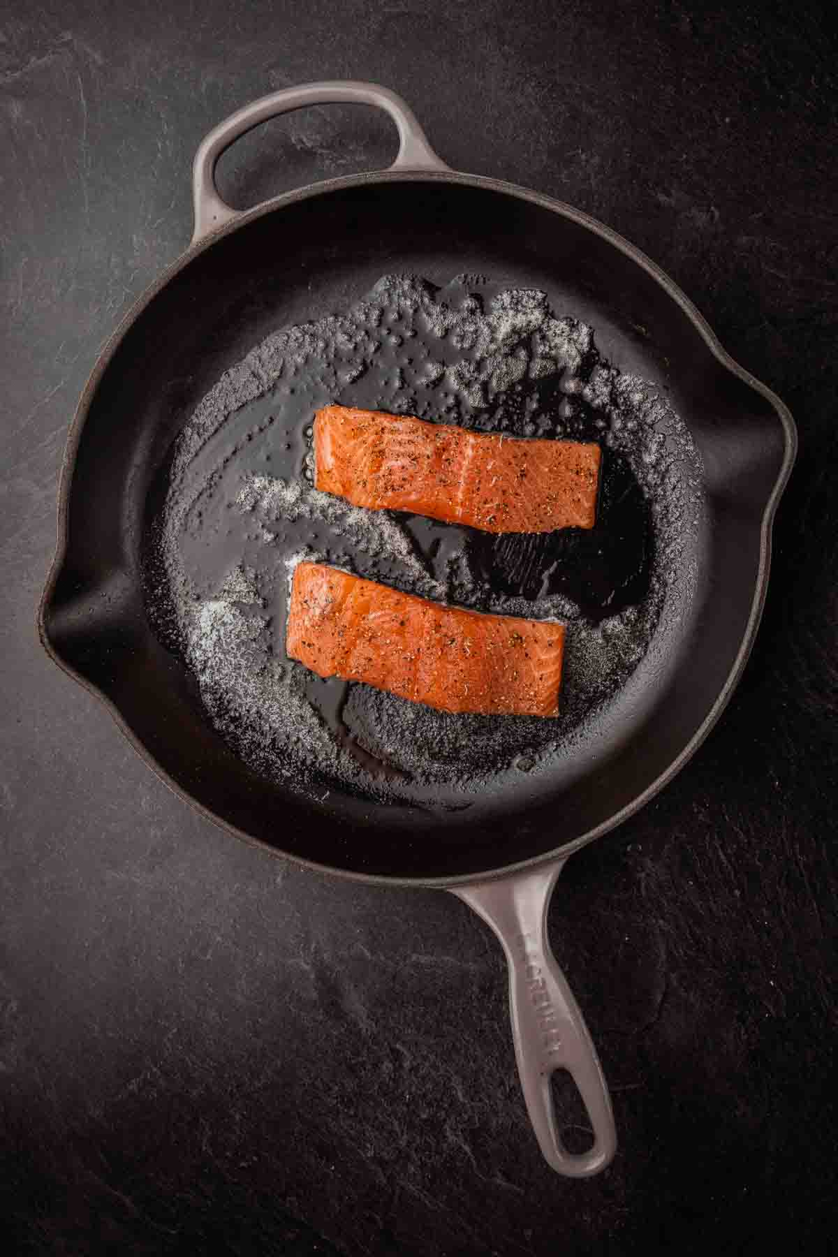 Fillets in a hot skillet, skin side down. 