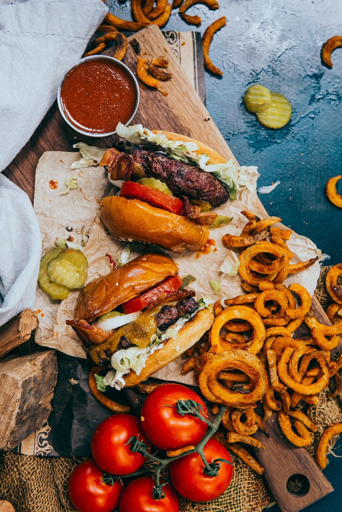 Overhead shot of a burger with toppings and fries. 