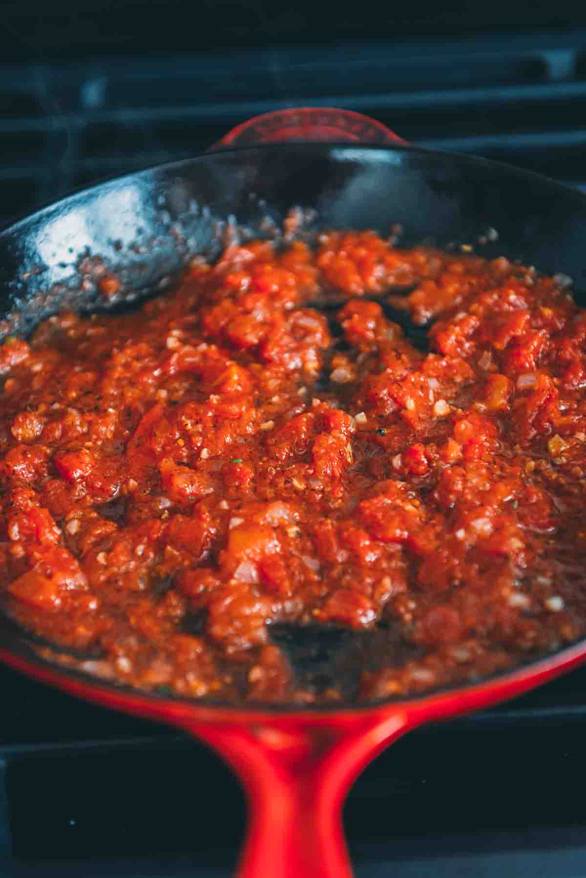 Driced tomatoes in a skillet.