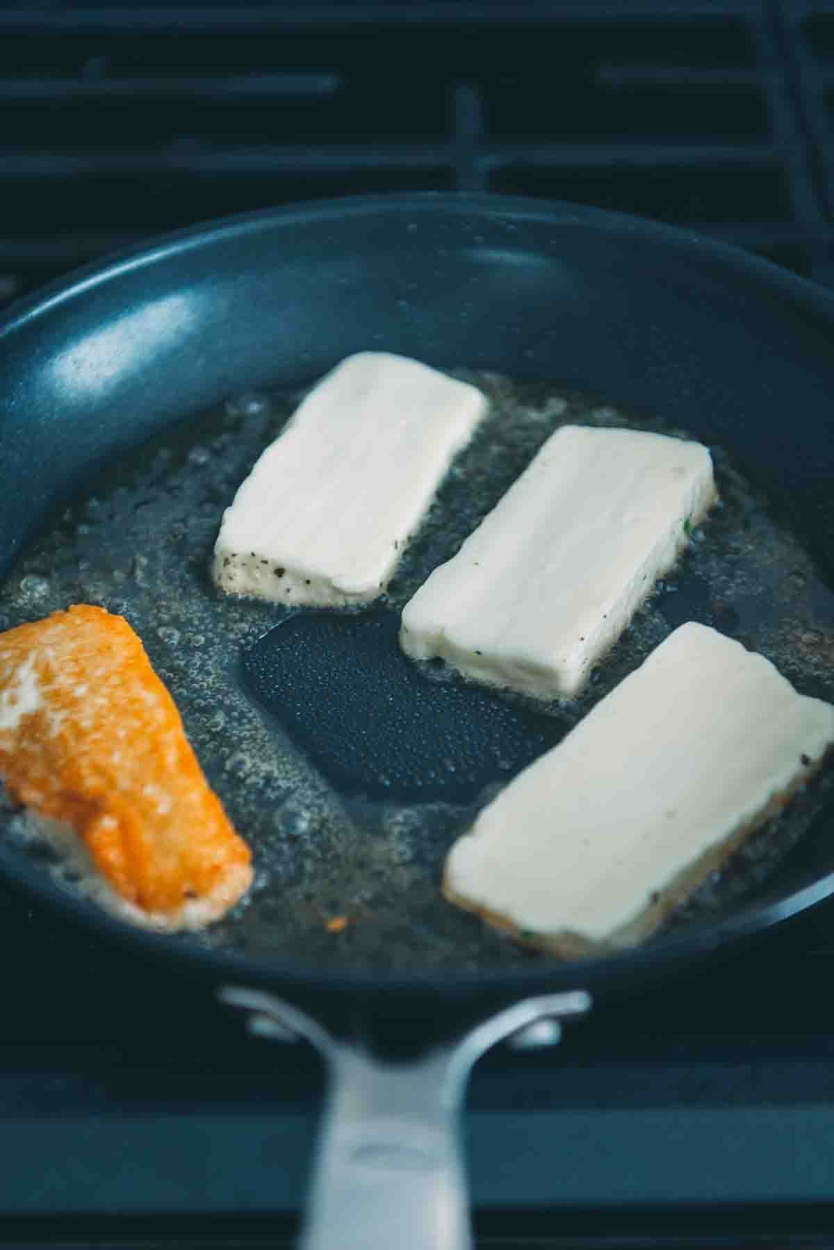 Cheese in a frying pan.