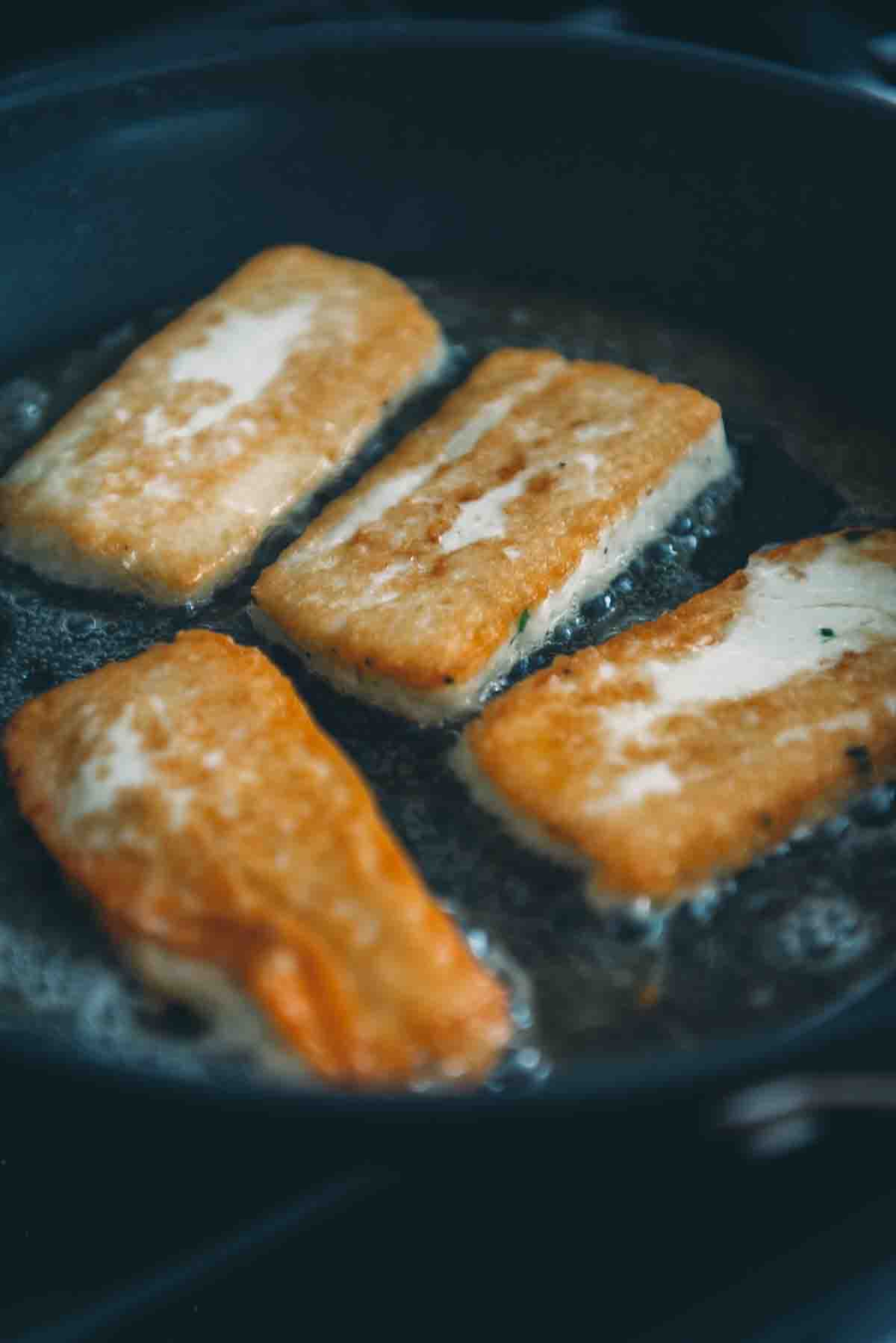 Fried cheese in a pan.