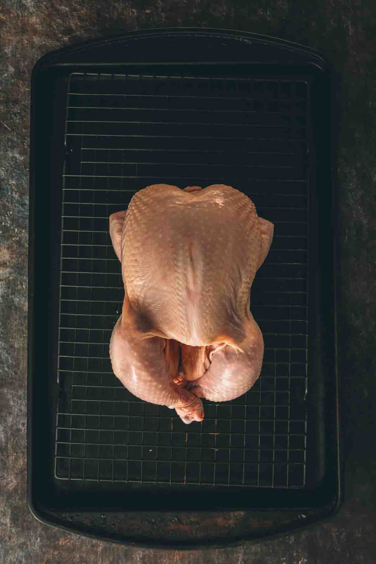 Whole free range chicken, patted dry and placed on a wire rack on a baking sheet. 