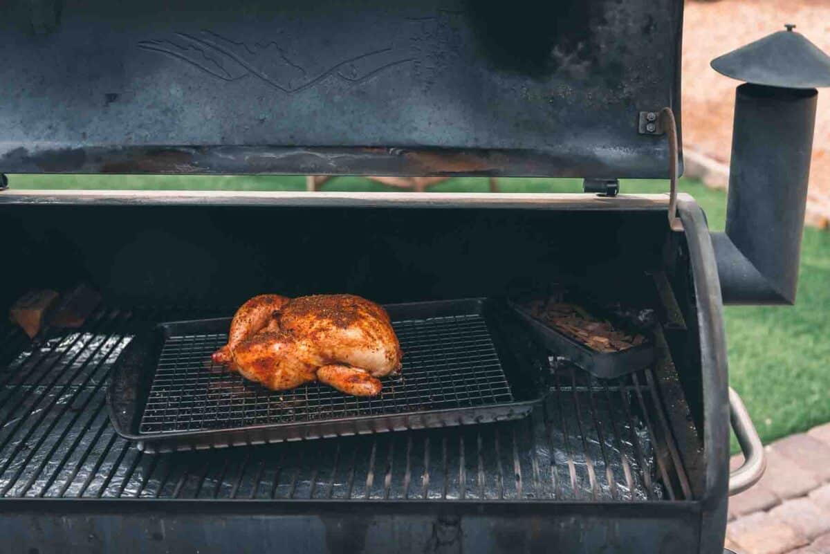 Chicken smoking on a Traeger grill. 