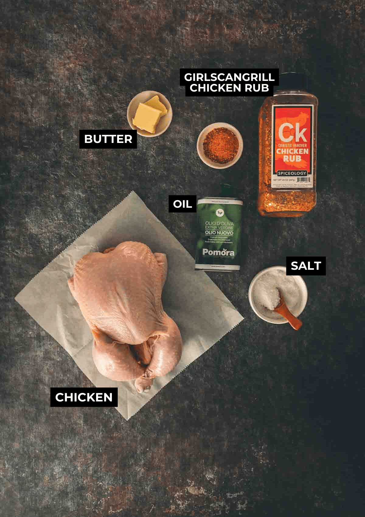 Ingredients for whole smoked chicken on a black board. 