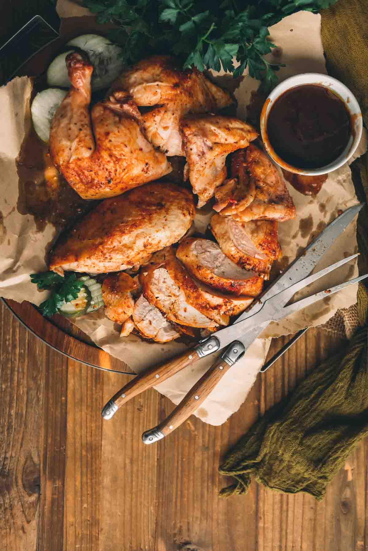 Whole chicken carved into portions, breast, wings, quarters and wings. 