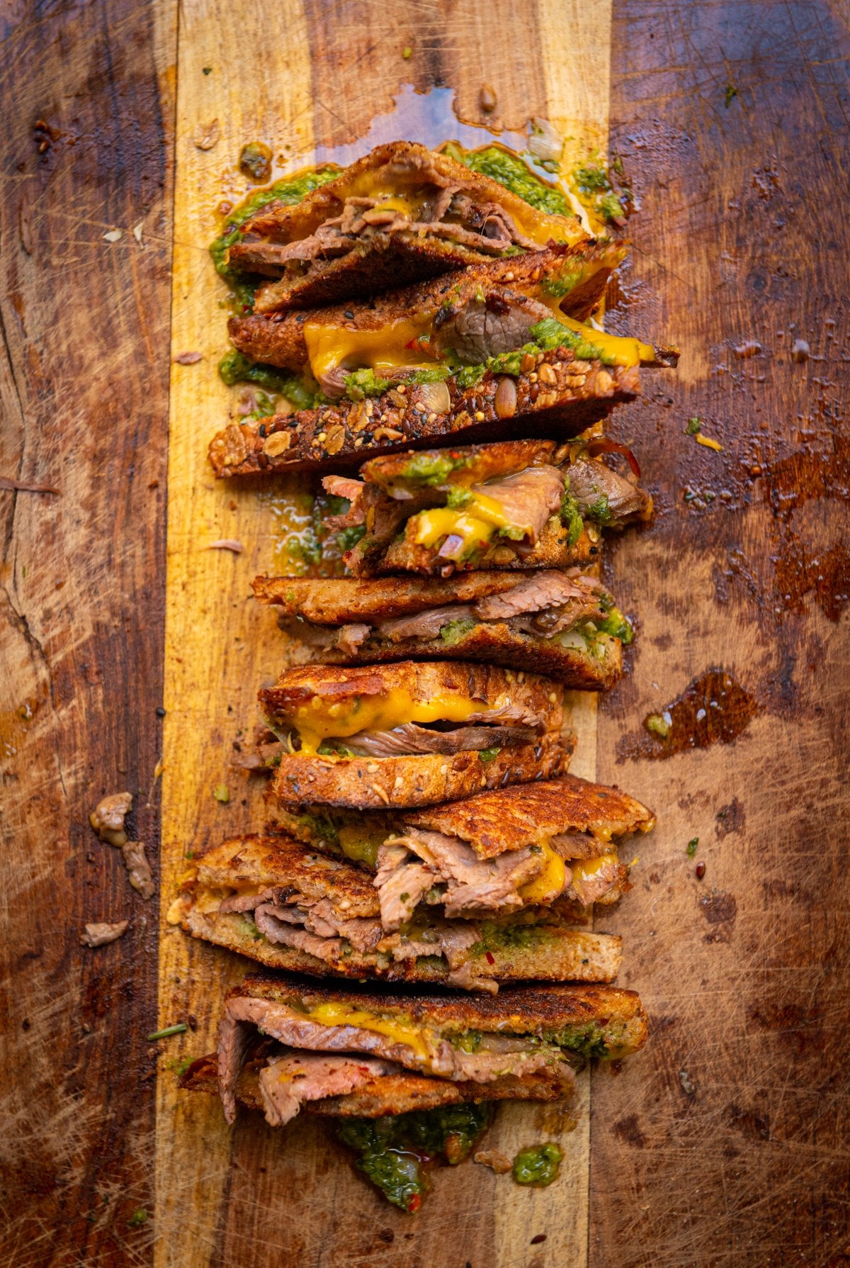 Messy grilled cheese with thinly sliced meat, cheese and chimlichurri. 