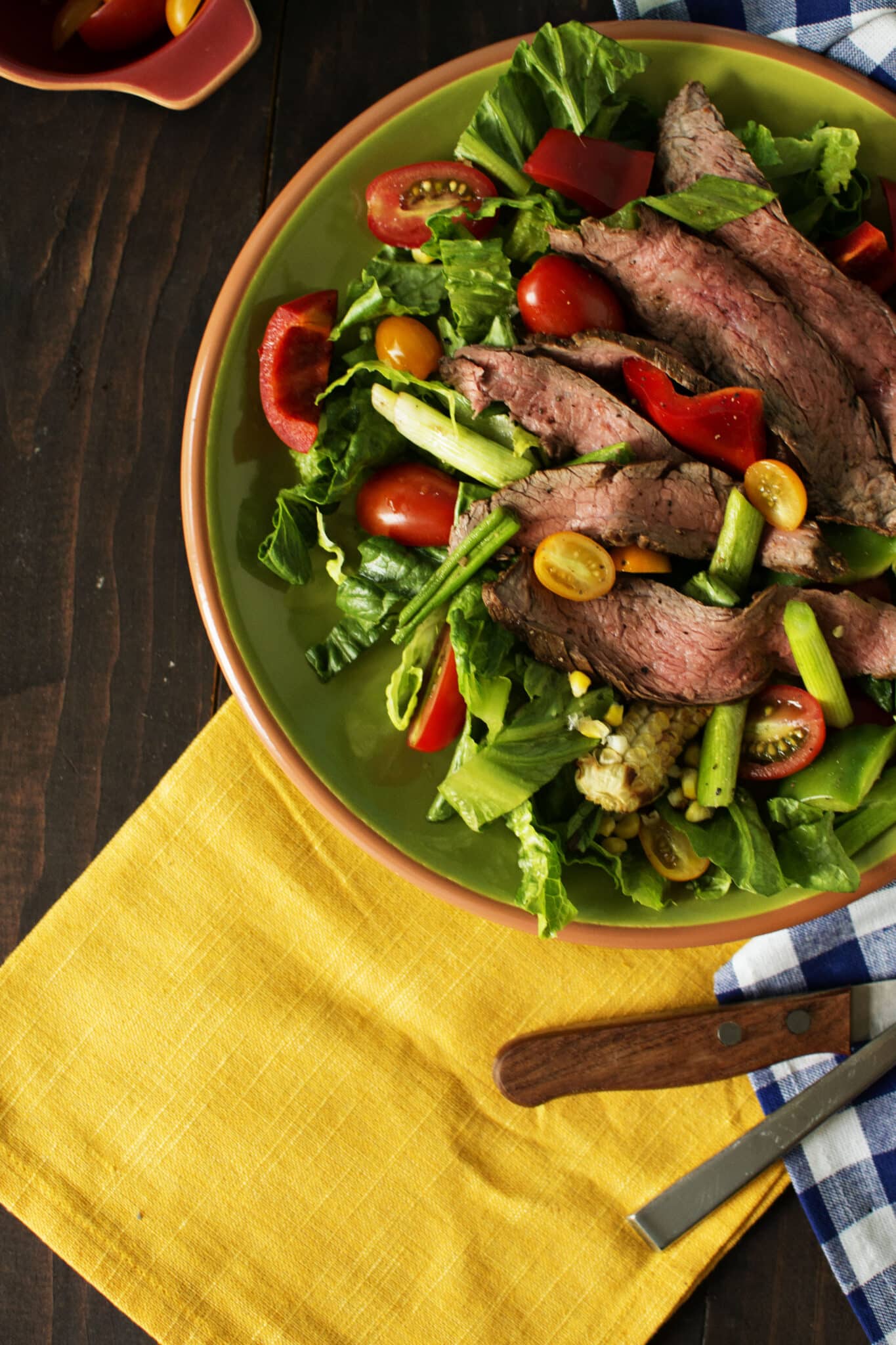 Overhead image of platter of of steak salad. 