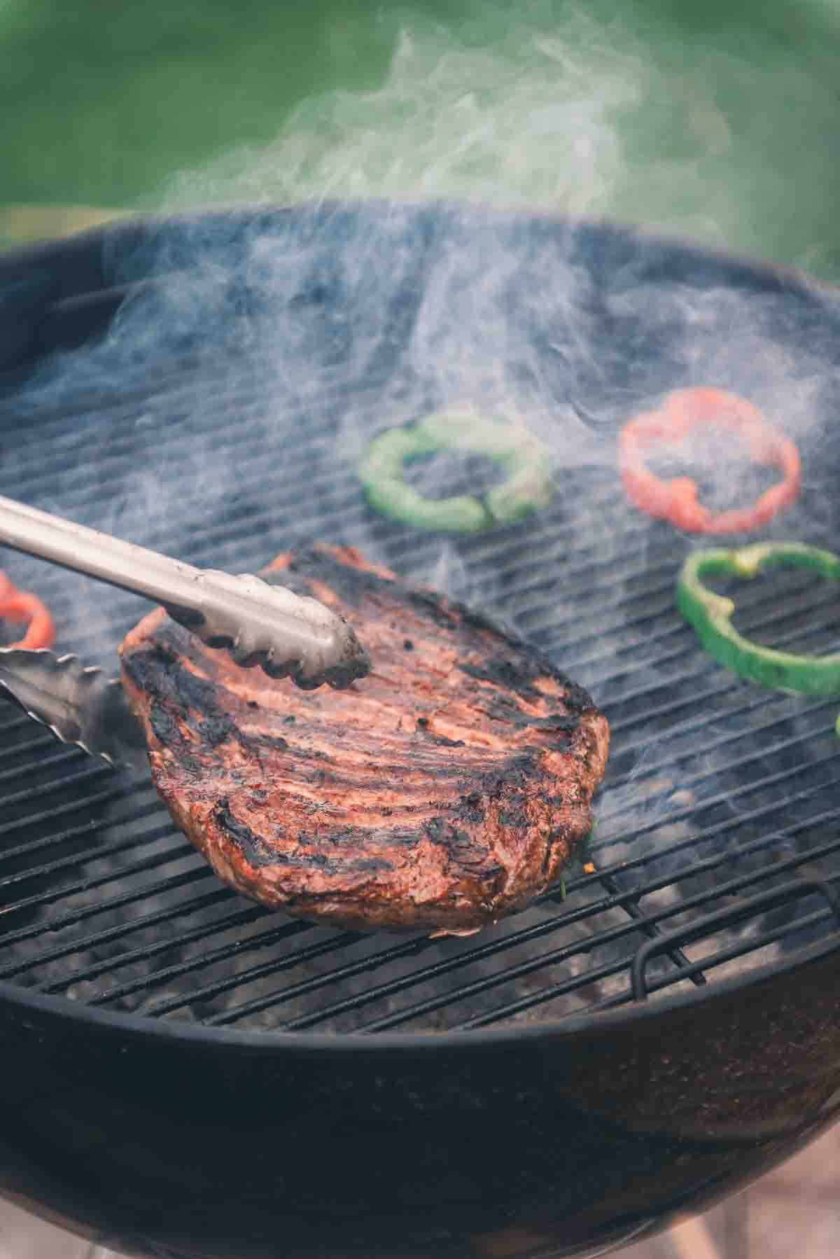 Flank steak on grill. 