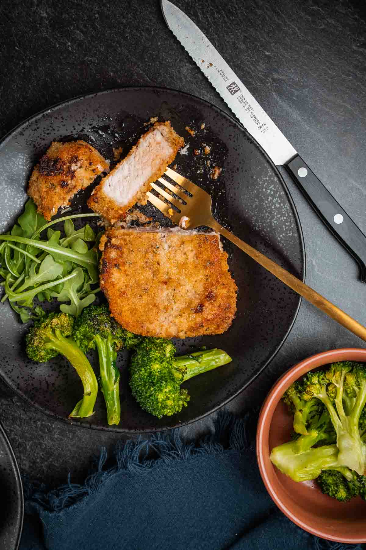 Tender boneless pork chops sliced open to show juicy meat. 
