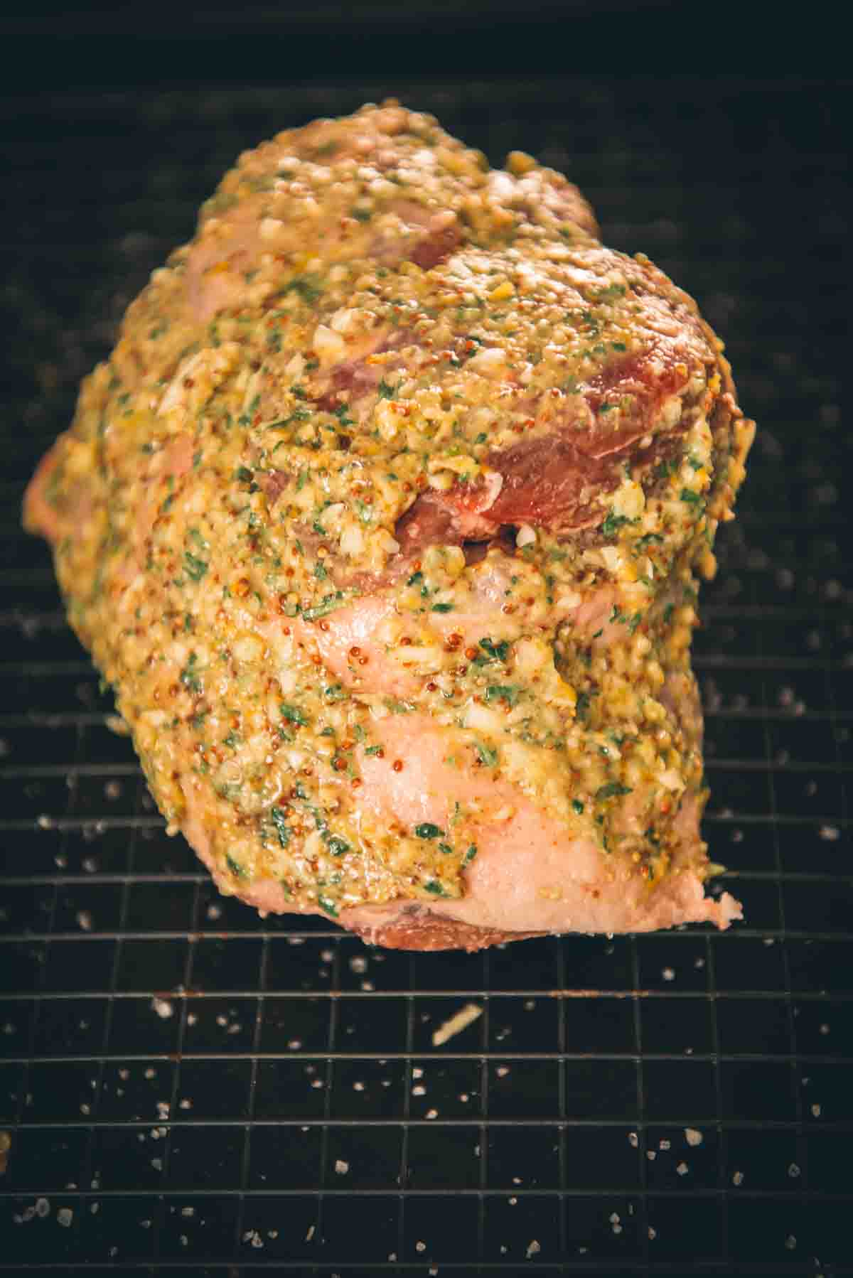 Showing close up of mustard herb mix on lamb.