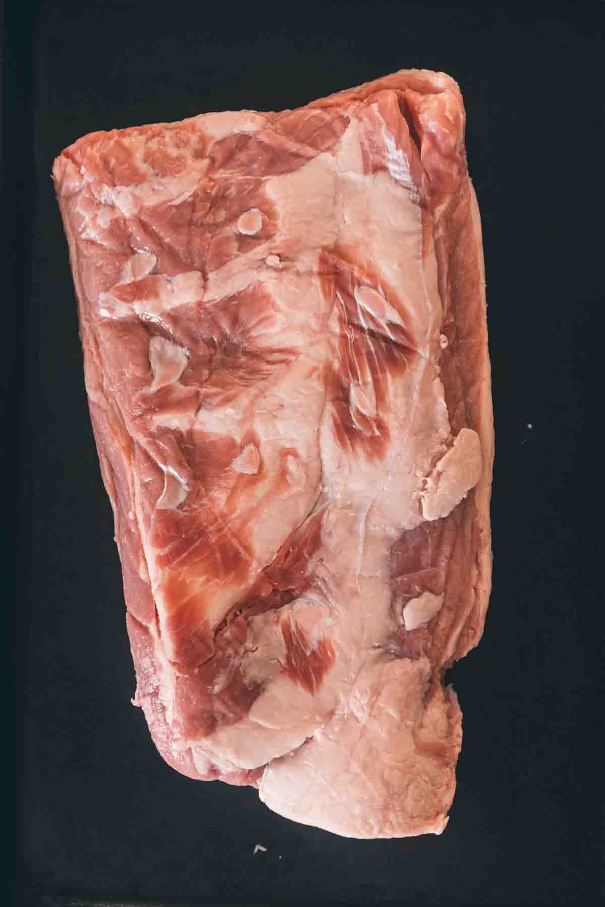 Breast of veal to show the cut, fat side down.
