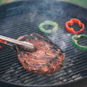 Grilled flank steak with peppers.