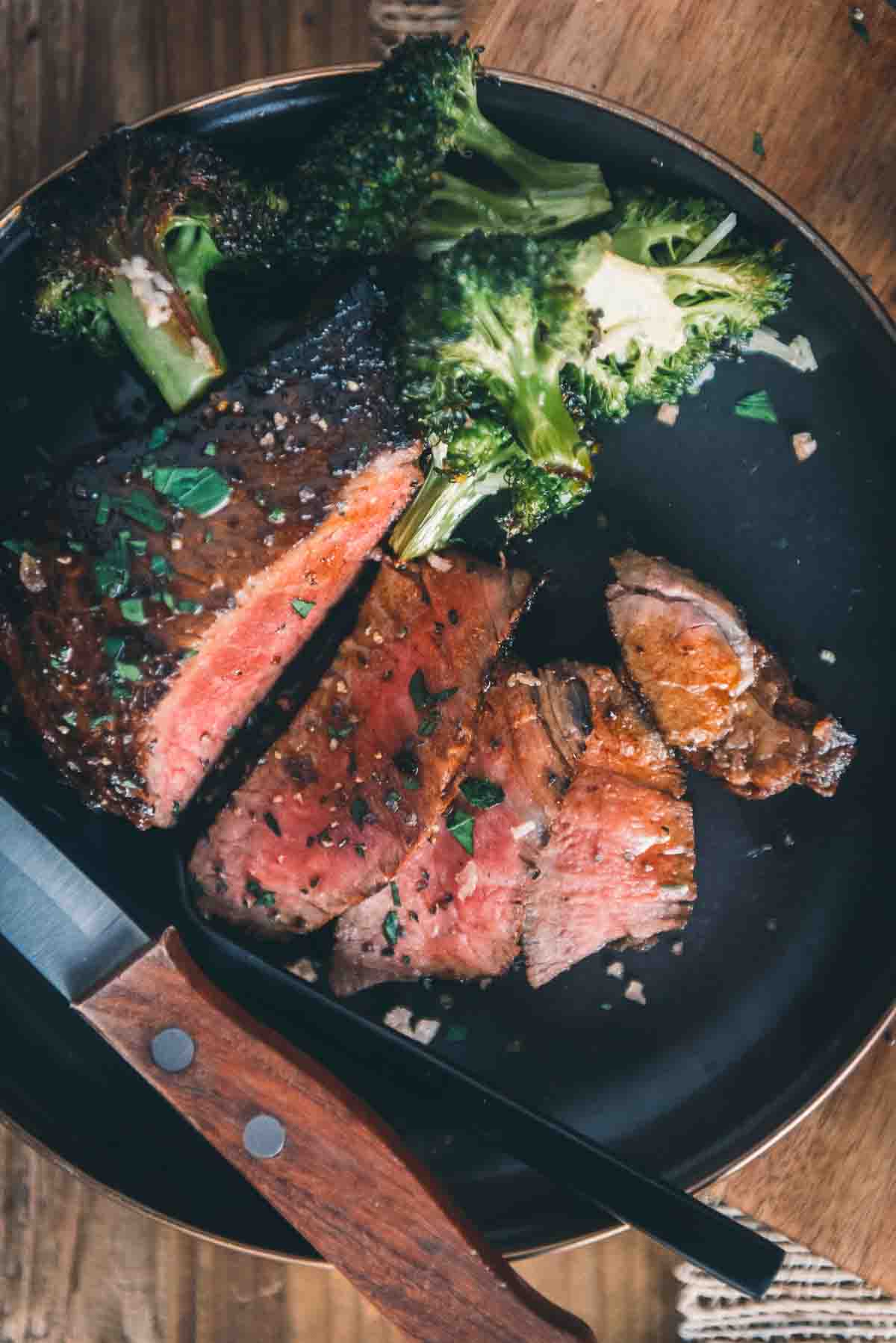 Tender steak with medium rare center sliced for serving. 