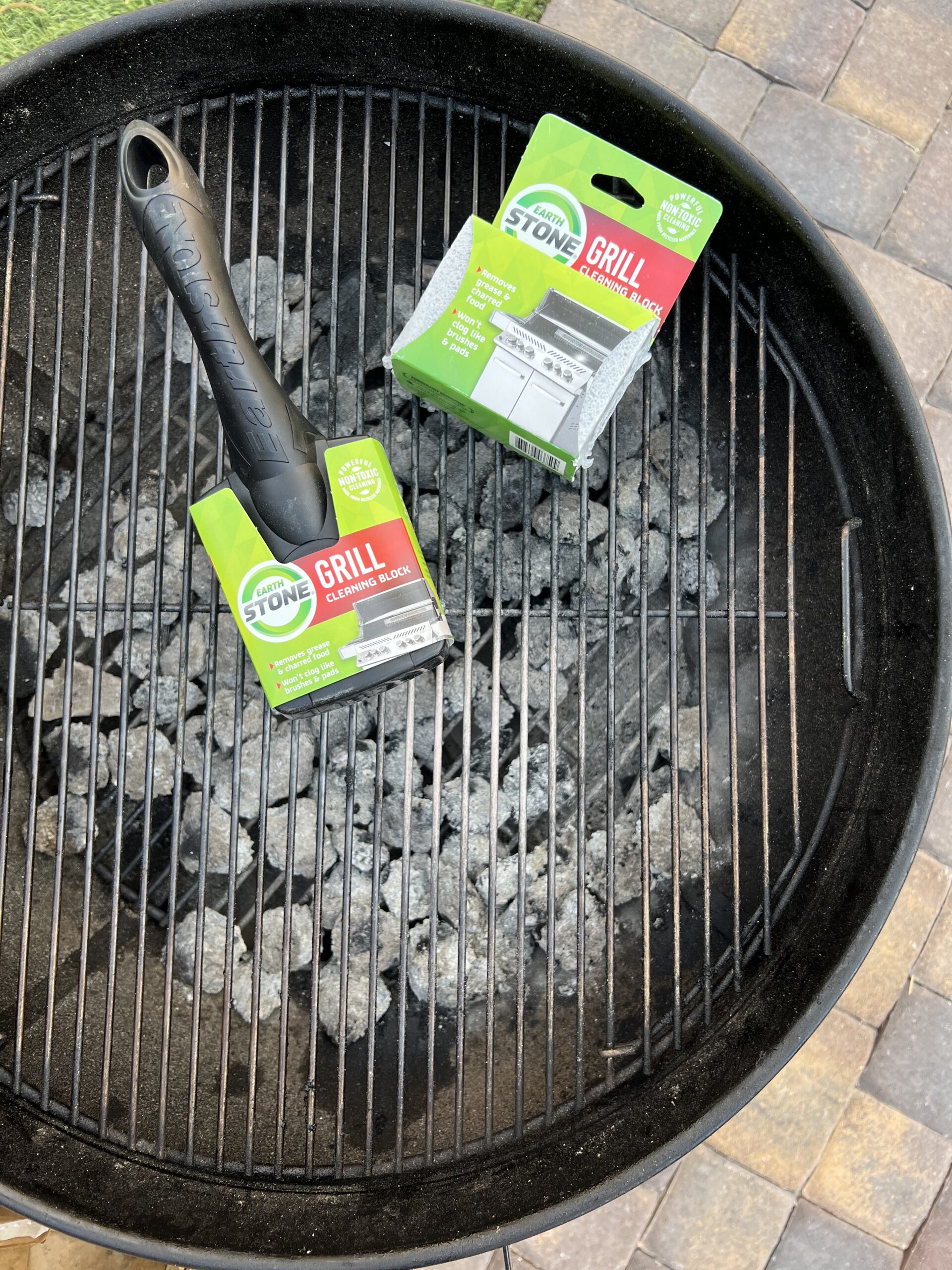 Cleaning stones on grill grate. 