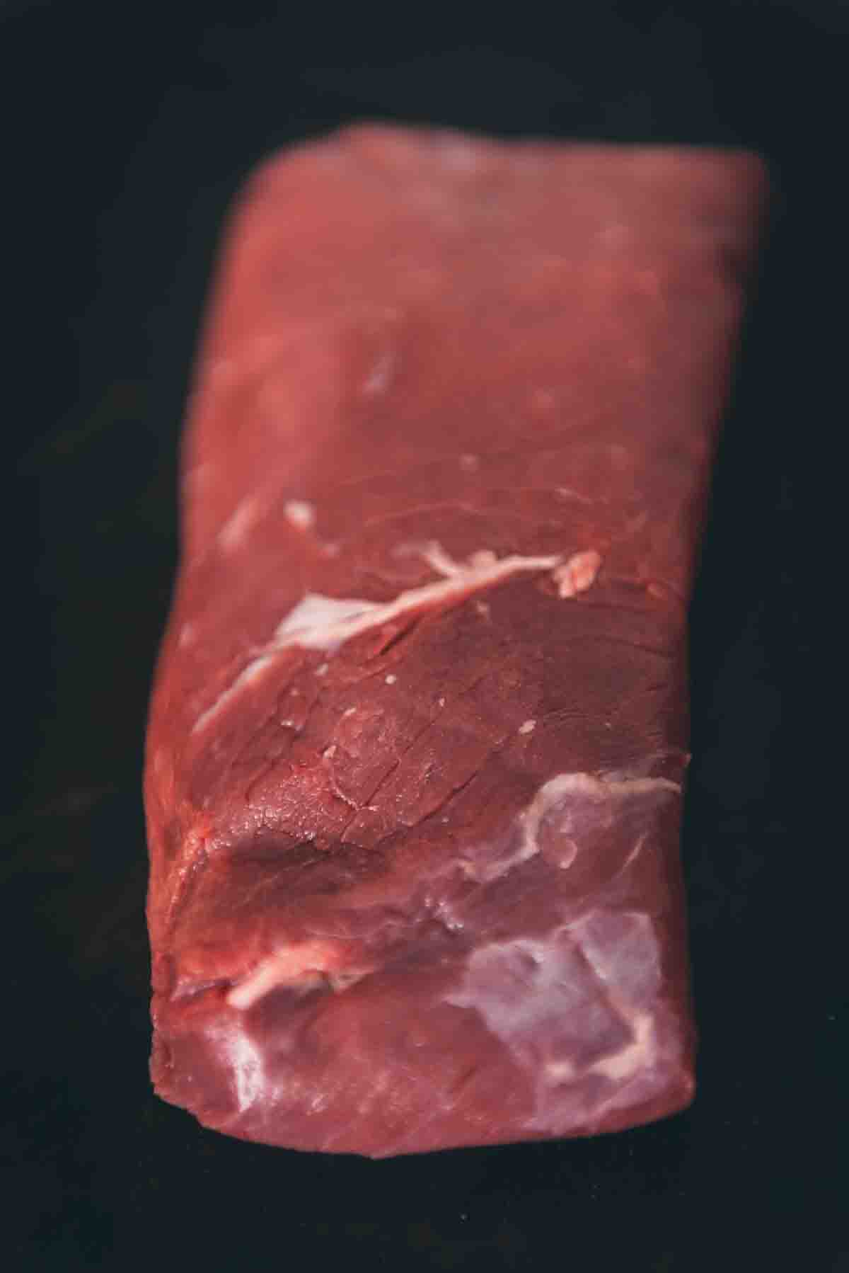 Merlot steak close up to show unique cut and grain.
