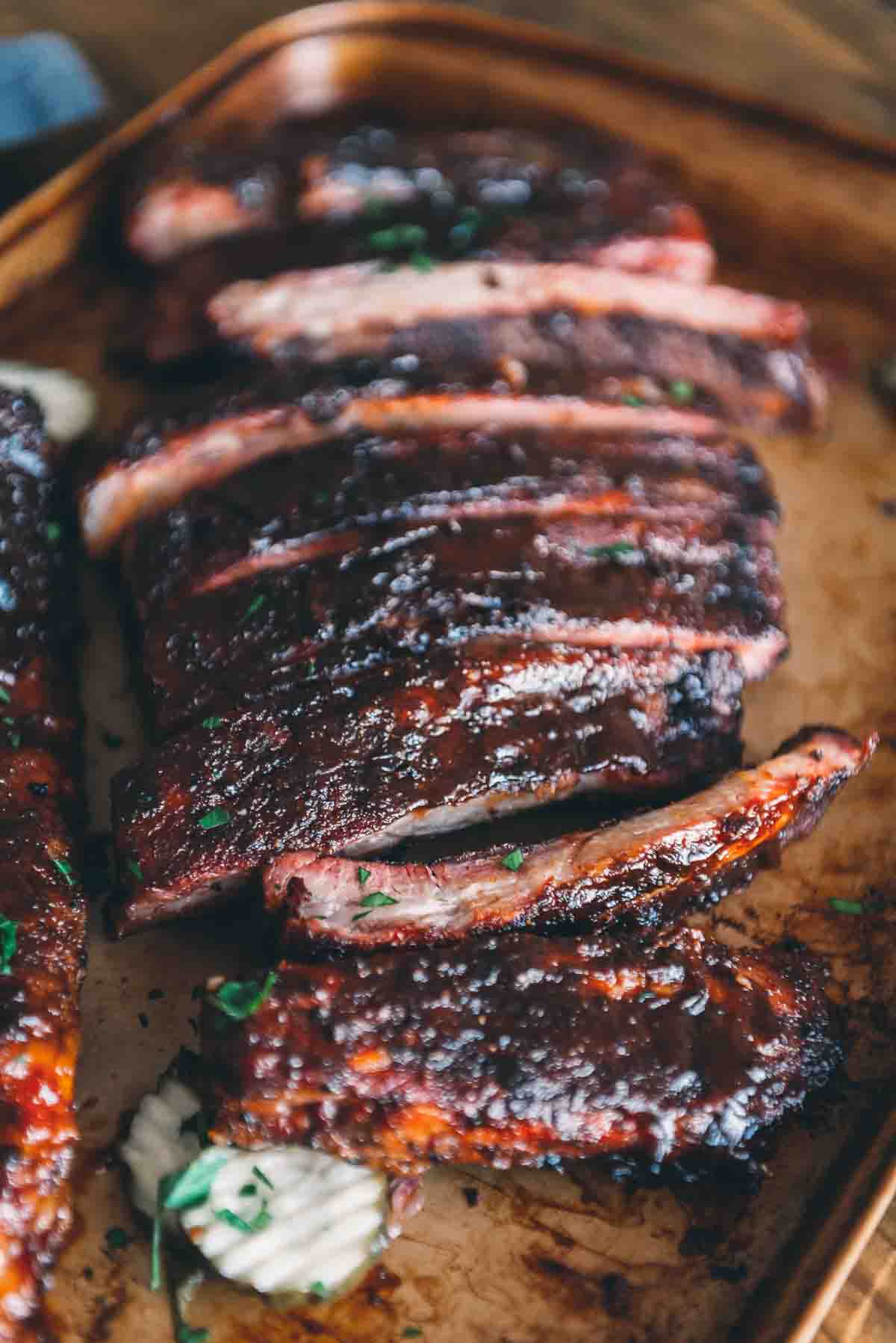Ribs smoked and sliced to serve on a tray. 