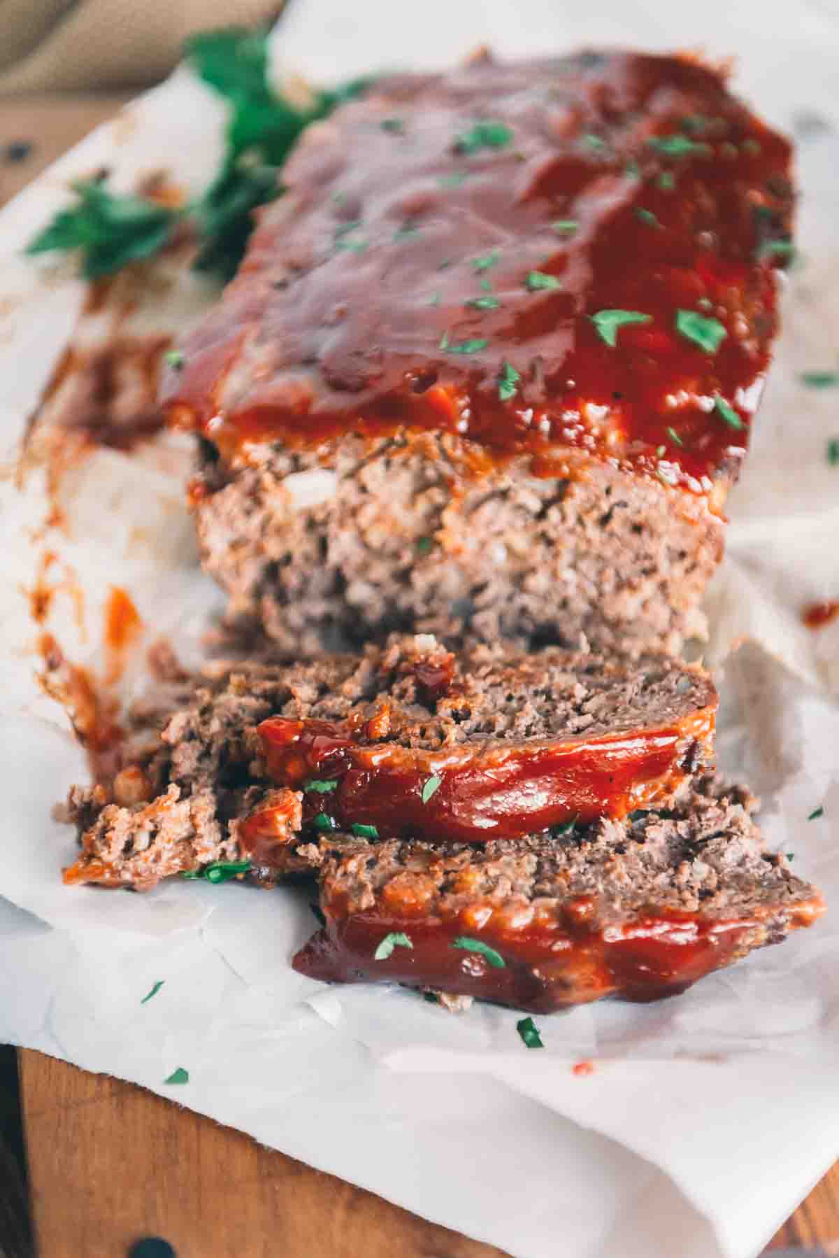 Meatloaf slices with ketchup glaze.