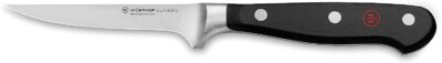 A knife with a black handle on a white surface.