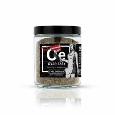 A jar of cee over fast seasoning on a white background.