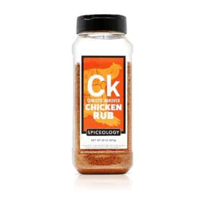 A jar of ck chicken rub on a white background.