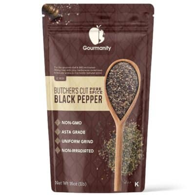 A pouch of black pepper with a spoon.