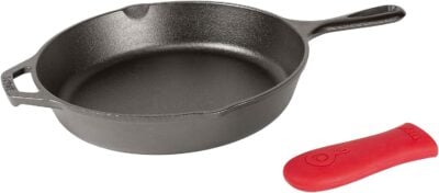 A cast iron skillet with a red spatula.