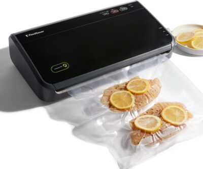 A food vacuum sealer with lemon slices on it.