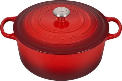 A red le creuset pot on a white background.