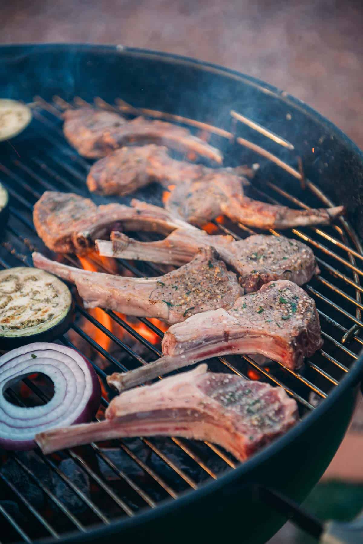 Close up on lamb chops on charcoal grill. 