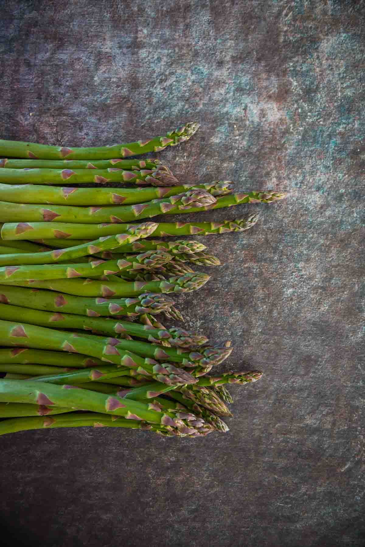 Fresh asparagus on a board. 
