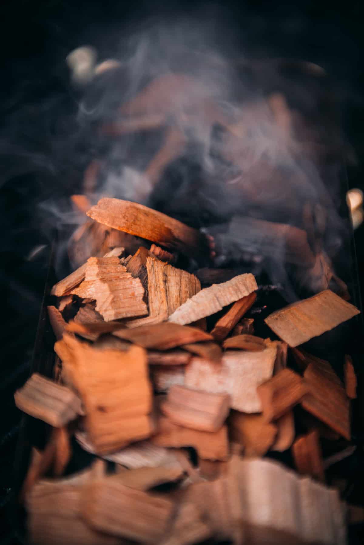 Close up of wood chips just starting to produce smoke. 