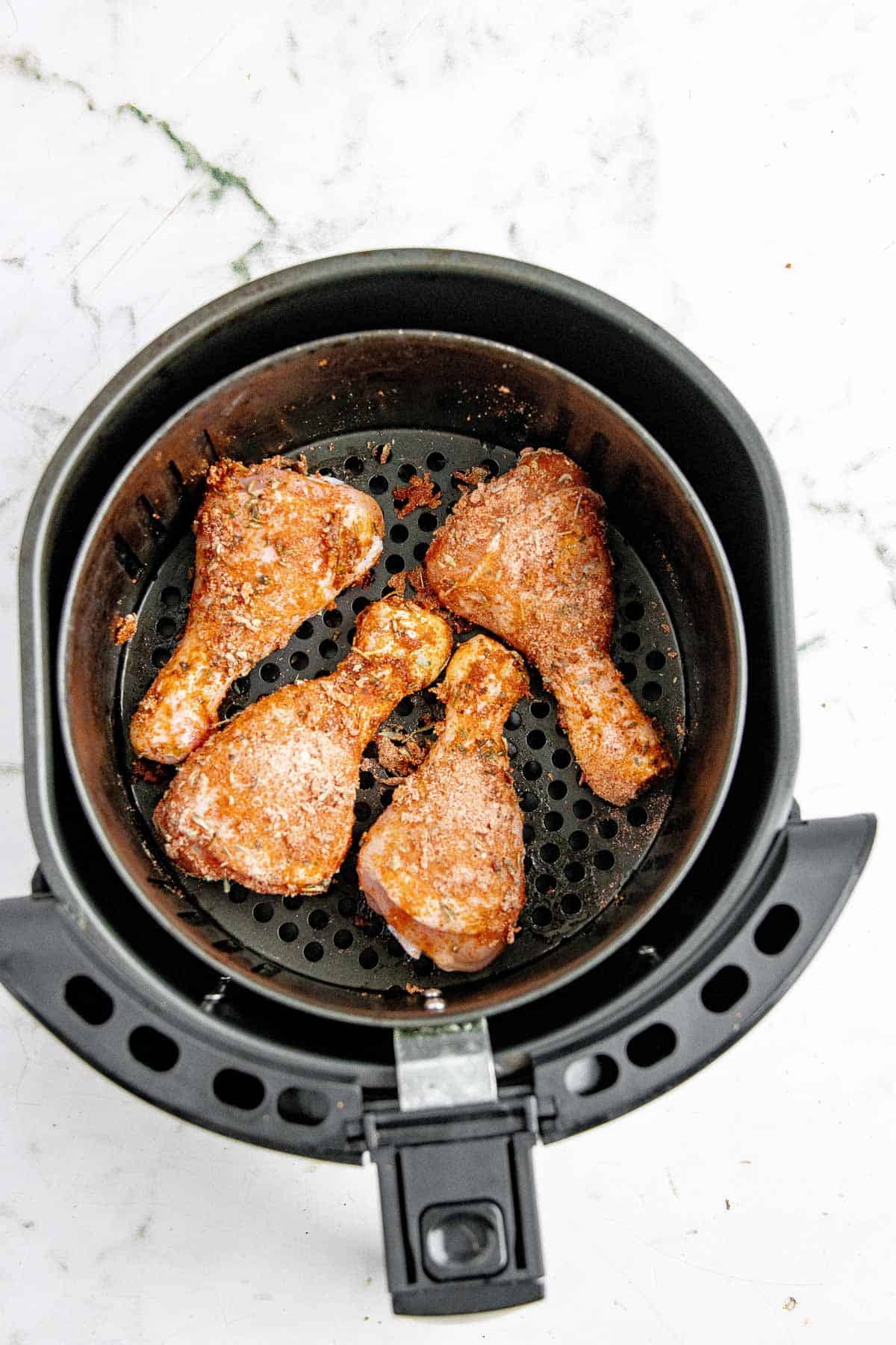 Seasoned chicken in the air fryer.