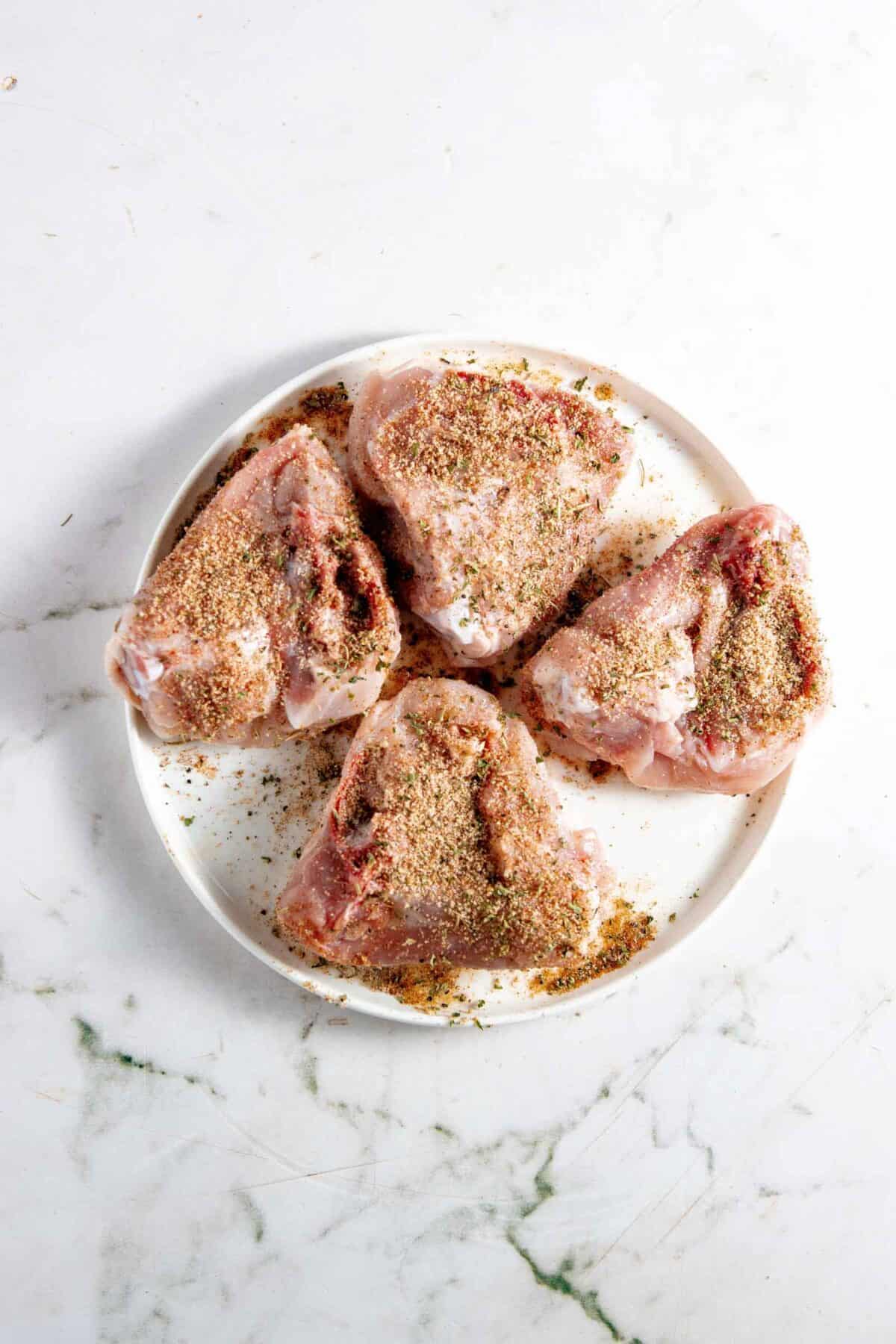 Chicken thighs rubbed with spices.